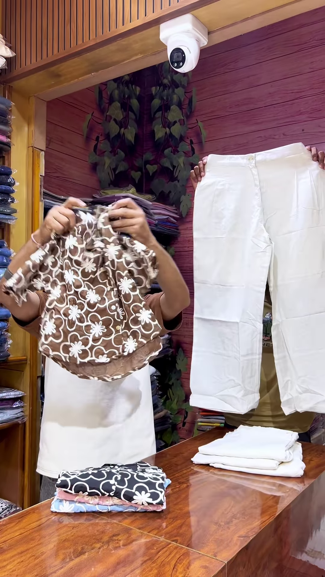 Blue Floral Crop Top with V-Neckline Paired with White Straight-Fit Pants - Image 3