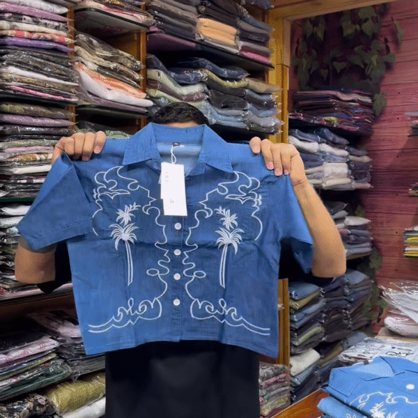 Light Blue Long-Sleeve Shirt with White Floral Embroidery and Button-Front Closure