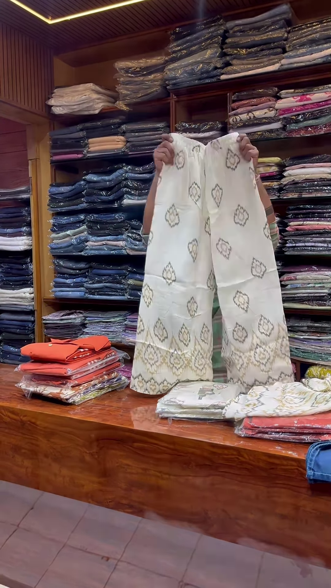 Orange Sleeveless V-Neck Vest with White Embroidered Edges and Button Closure - Image 2