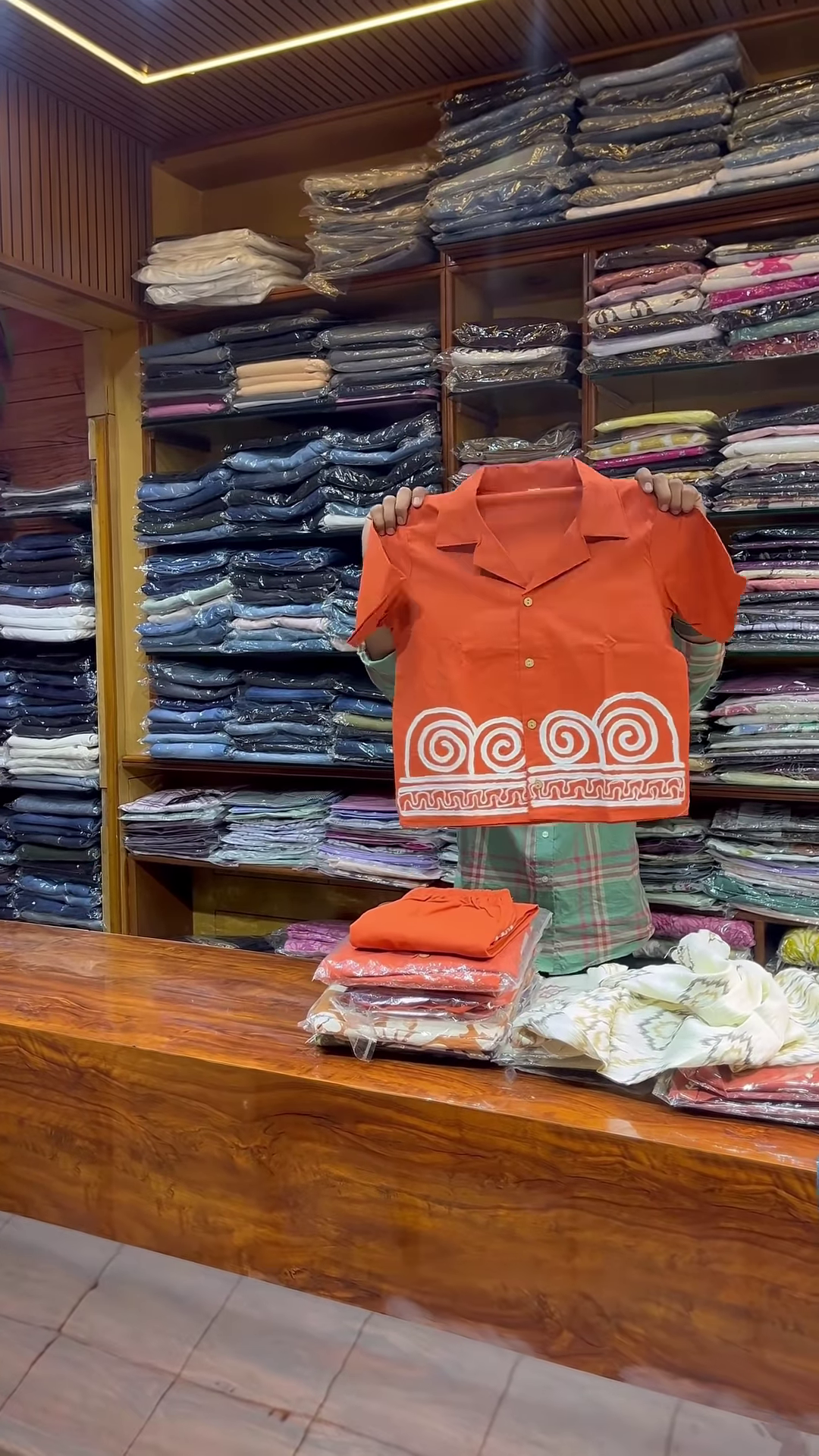 Orange Sleeveless V-Neck Vest with White Embroidered Edges and Button Closure