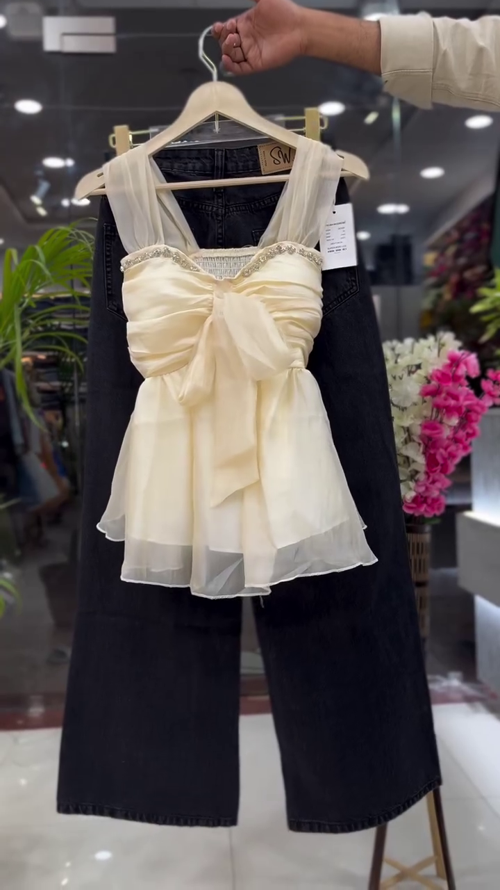 β¨ Elegant & Chic: White Sleeveless Organza Ruffled Top with Embellished Neckline & Dark Trousers π - Image 3