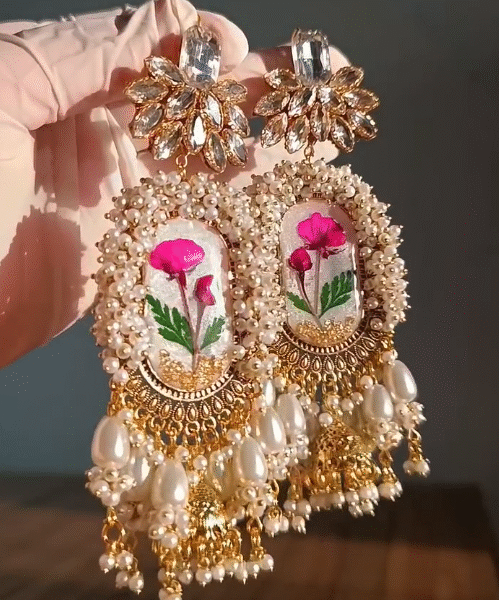 Handcrafted Real Flower Resin Jhumka Earrings – Pearl & Glitter Embellished with Gold-Plated Frame