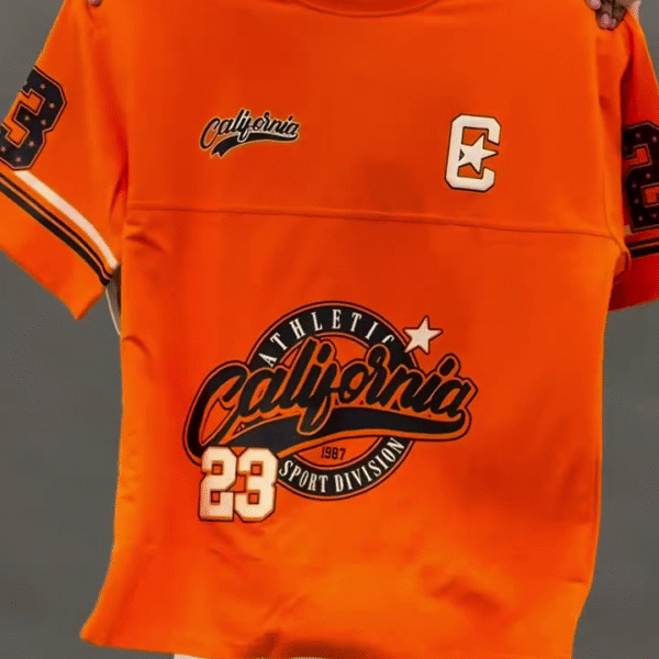 “Power in Motion: Orange Athletic Graphic T-Shirt for Bold Performance Style” 🧡🏃‍♂️👕